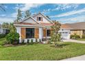 One story home with teal front door and shutters at 5347 Southern Valley Loop, Brooksville, FL 34601