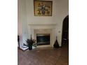 Classic fireplace featuring tile surround and hearth with decorative mantle at 12266 Birch St, Brooksville, FL 34613