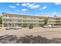View of condo building showing parking and landscaping at 2260 Costa Rican Dr # 26, Clearwater, FL 33763