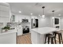Modern kitchen featuring white cabinets and stainless steel appliances at 3452 Umber Rd, Holiday, FL 34691