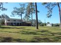 House on a spacious lot with a detached shed and large yard at 8700 Ross Ln, New Port Richey, FL 34654
