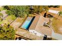 Aerial view showing home, pool, and backyard at 9053 Nakoma Way, Weeki Wachee, FL 34613
