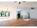 Bright and airy living room with hardwood floors and high ceilings at 9053 Nakoma Way, Weeki Wachee, FL 34613