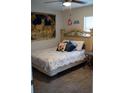 Cozy bedroom with a queen-size bed and tapestry wall hanging at 11261 Redgate St, Spring Hill, FL 34609