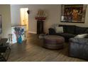 Spacious living room with a comfy sectional sofa and a large framed print at 11261 Redgate St, Spring Hill, FL 34609
