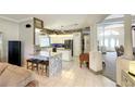 Kitchen boasts granite countertops, stainless steel appliances, and a breakfast bar at 12289 Glen Haven St, Spring Hill, FL 34609