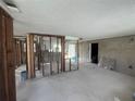 Living room showcasing exposed walls offering a customizable space for renovation and personalization at 13639 Frances Ave, Hudson, FL 34667