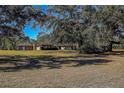 Ranch home nestled among large oak trees on a spacious lot at 10525 Hilltop Dr, New Port Richey, FL 34654
