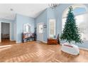 Bright living room with hardwood floors and vaulted ceilings at 1249 Mazarion Pl, Trinity, FL 34655