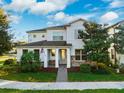 Two-story home with stone accents and a landscaped yard at 13022 Payton St, Odessa, FL 33556