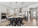 Modern kitchen featuring a large island and stainless steel appliances at 13022 Payton St, Odessa, FL 33556