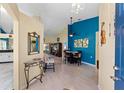 Bright and spacious entryway with view into living and dining areas at 1400 Summerwood Ct, Spring Hill, FL 34606