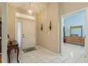 Bright entryway with tiled floor and view into the bedroom at 6604 Rosemont Ct, New Port Richey, FL 34655