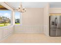 Dining room with a chandelier and large windows offering natural light at 4201 Silver Berry Ct, Spring Hill, FL 34609