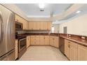 Kitchen features granite countertops and ample cabinetry at 4201 Silver Berry Ct, Spring Hill, FL 34609