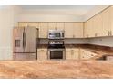 Modern kitchen with granite countertops and stainless steel appliances at 4201 Silver Berry Ct, Spring Hill, FL 34609