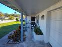 Covered porch, offering views of the street and yard at 7552 Cumber Dr, New Port Richey, FL 34653