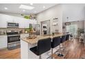 Modern kitchen with stainless steel appliances and granite countertops at 10464 Henderson St, Spring Hill, FL 34608
