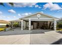 Two-car garage with the door open, showing storage and a boat at 13610 Evelane Dr, Hudson, FL 34667