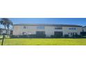 Condo building with a grassy area in the background at 4901 Onyx Ln # 202, New Port Richey, FL 34652