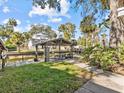Covered waterfront dock with picnic table, offering relaxing canal views at 7195 Bethesda Ct, Weeki Wachee, FL 34607