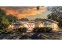 House exterior at dusk showcasing architectural details and landscaping at 7256 Royal Oak Dr, Spring Hill, FL 34607