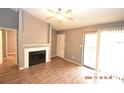 Living room with fireplace and sliding door at 8718 Mallard Reserve Dr # 202, Tampa, FL 33614