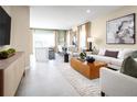 Open concept living and kitchen area with tile floors at 12458 Amber Creek Cir, Lakewood Ranch, FL 34211