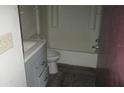 Clean bathroom with a tub and gray vanity at 12719 Lockey Ln, Tampa, FL 33612