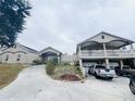 Two-story house with a large driveway and attached garage at 7941 Sycamore Dr, New Port Richey, FL 34654