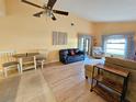 Open living space featuring a seating area and dining table at 9163 Lingrove Rd, Weeki Wachee, FL 34613