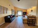 Spacious living room with light flooring and comfortable seating at 9163 Lingrove Rd, Weeki Wachee, FL 34613