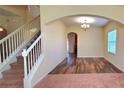 Formal dining room with hardwood floors and an arched entryway at 10167 Bankston Dr, Hudson, FL 34667
