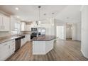 Modern kitchen featuring white cabinets, granite countertops, and a large island at 1852 Cypress Point Ln, Sarasota, FL 34234