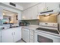 Efficient kitchen featuring white cabinetry and modern appliances at 3644 Trophy Blvd, New Port Richey, FL 34655