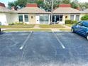 View of condo parking lot with assigned parking spaces at 4375 Tahitian Gardens Cir # B, Holiday, FL 34691