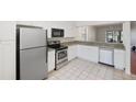 Modern kitchen with stainless steel appliances and granite counters at 121 Lindsay Ln # 31, Oldsmar, FL 34677