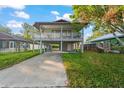 Elevated home with a spacious deck and large backyard at 1244 31St E Ave, Bradenton, FL 34208