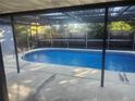 Inviting backyard pool with clear blue water and patio area, perfect for relaxation and outdoor enjoyment at 12804 Waterbury Ave, Hudson, FL 34669