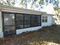 White screened porch with black framed windows at 4392 Craftsbury Dr, New Port Richey, FL 34652