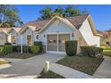 Light blue home with a two-car garage and nicely landscaped yard at 4808 Vesper Ct, New Port Richey, FL 34655