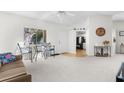 Bright living room with open floor plan and kitchen view at 8190 Sturbridge Ct, Weeki Wachee, FL 34613