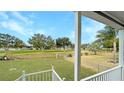 Spacious backyard with a view of a green golf course at 14287 Rialto Ave, Brooksville, FL 34613