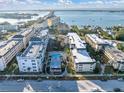 Aerial view of Port Bellaire condos, showcasing the waterfront location and community pool at 155 Bluff View Dr # 103, Belleair Bluffs, FL 33770