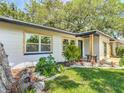 Exterior view of a house with a white facade and landscaping at 4629 26Th S Ave, St Petersburg, FL 33711