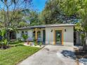 Renovated home with modern exterior and landscaped front yard at 4629 26Th S Ave, St Petersburg, FL 33711