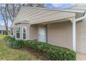 Close up view of home's front entrance and landscaping at 4846 Leyte Ct, New Port Richey, FL 34655