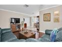 Spacious living room with hardwood floors and leather furniture at 4846 Leyte Ct, New Port Richey, FL 34655