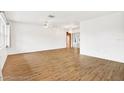 Bright living room featuring hardwood floors and lots of natural light at 6288 Airmont Dr, Spring Hill, FL 34606