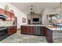 Spacious kitchen with an island, stainless steel appliances, and granite countertops at 14101 Andrew Scott Rd, Spring Hill, FL 34609
